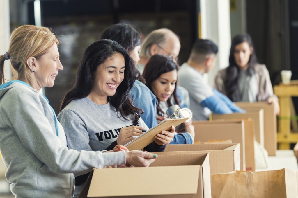 People filling boxes with donations