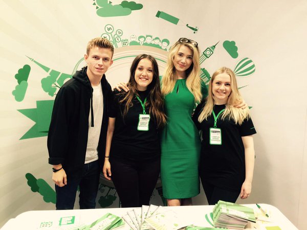 Campus Brand managers in front of Enterprise globe banner