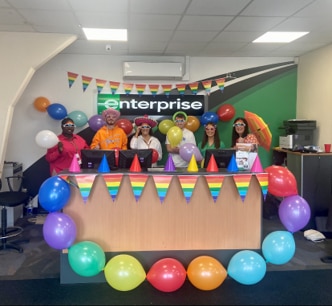 Shauna and other Enterprise employees with colorful balloons and decorations at Enterprise